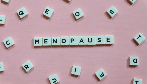 Menopause,Word,Made,Of,Square,Letter,Word,On,Pink,Background.