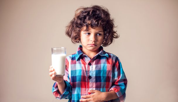 Kid,Boy,With,Stomach,Pain,Holding,A,Glass,Of,Milk.