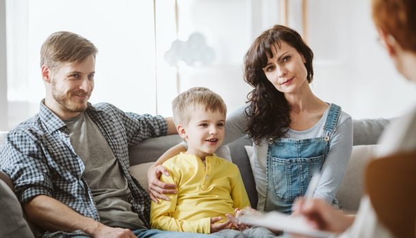 Caring,Parents,And,Misbehaving,Boy,During,Therapy,Session,With,Counselor