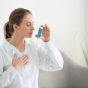 Female,Doctor,With,Inhaler,Having,Asthma,Attack,In,Clinic
