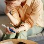Close,Up,Of,Depressed,Young,Woman,Holding,Pregnancy,Test,At