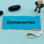 Dysmenorrhea.the,Word,Is,Written,On,A,Slip,Of,Colored,Paper.