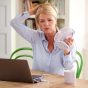 Menopausal,Mature,Woman,Having,Hot,Flush,At,Home,Cooling,Herself