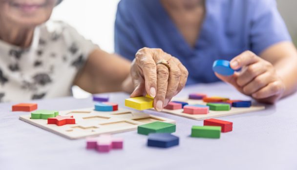 Caregiver,And,Senior,Woman,Playing,Wooden,Shape,Puzzles,Game,For