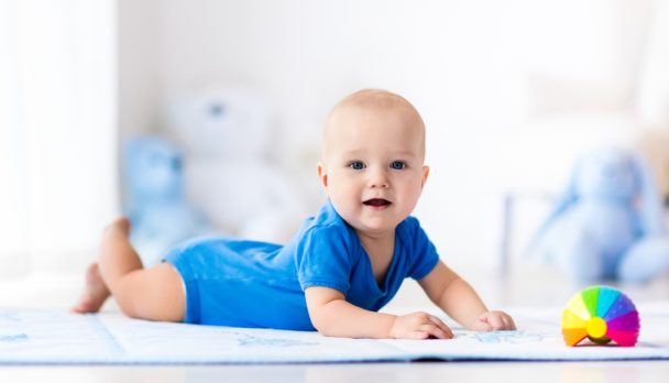 Adorable,Baby,Boy,Learning,To,Crawl,And,Playing,With,Colorful